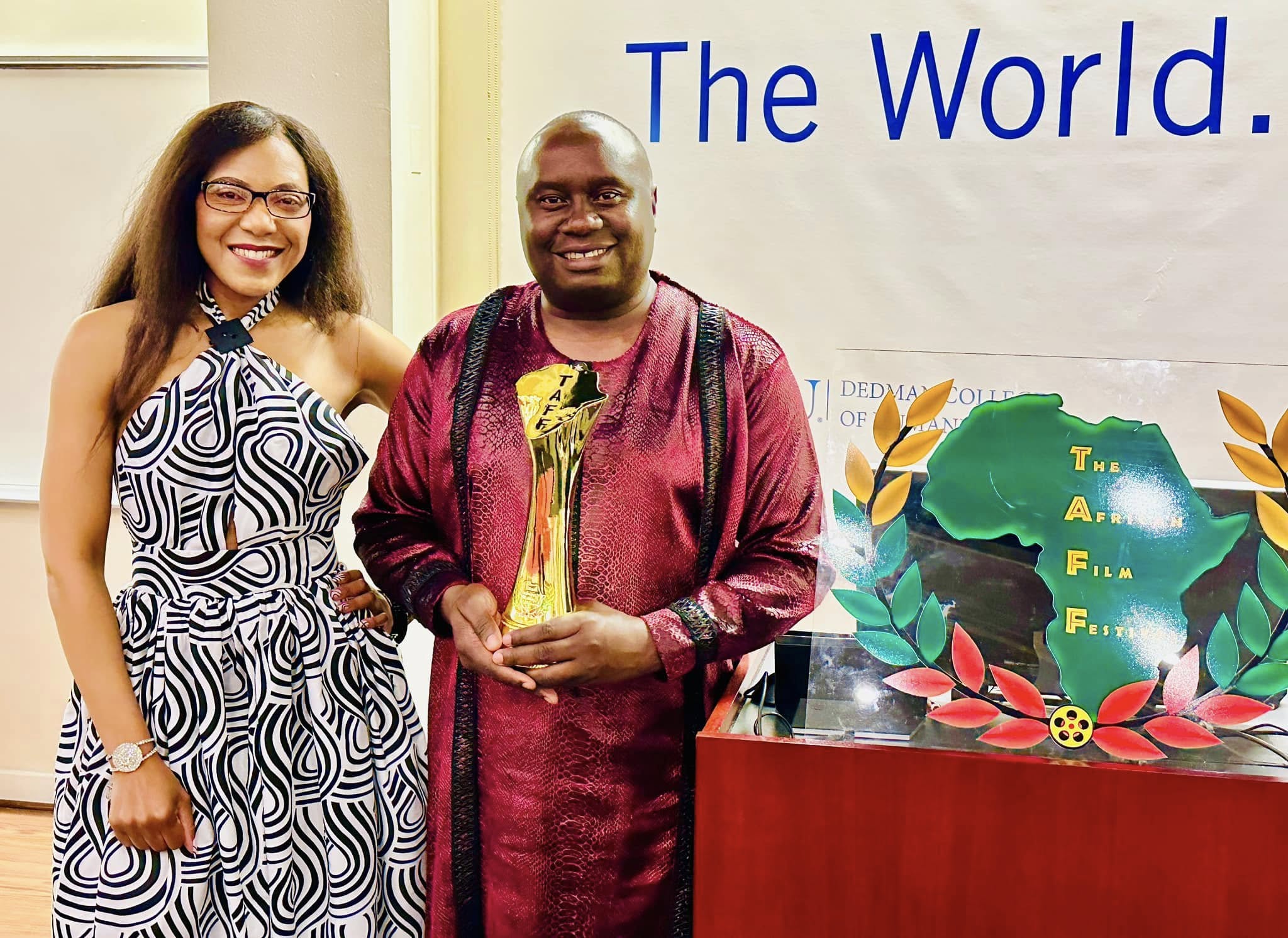 Dr. Davies Chirwa receiving The African Film Festival award