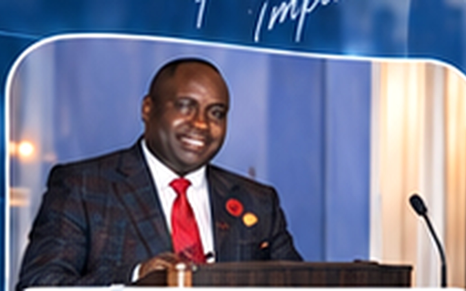 Dr. Davies Chirwa speaking on stage