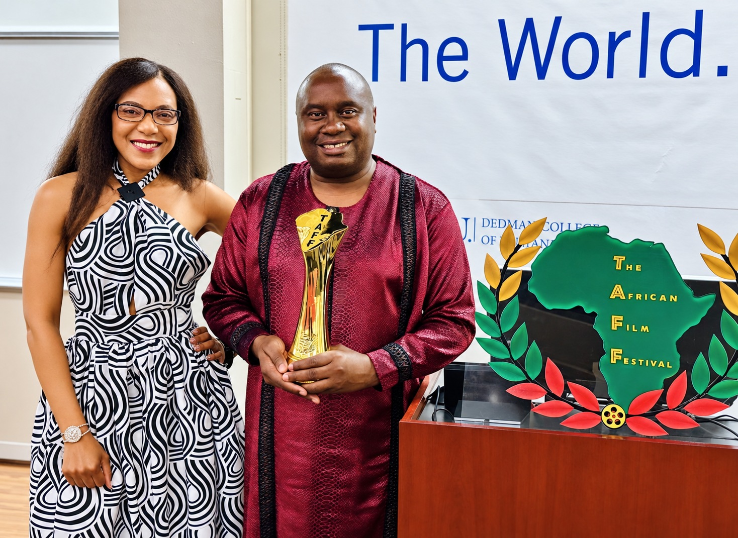 Davies Chirwa at the African Film Festival holding an award