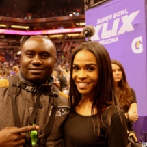 Davies Chirwa with Michelle Williams at Super Bowl XLIX